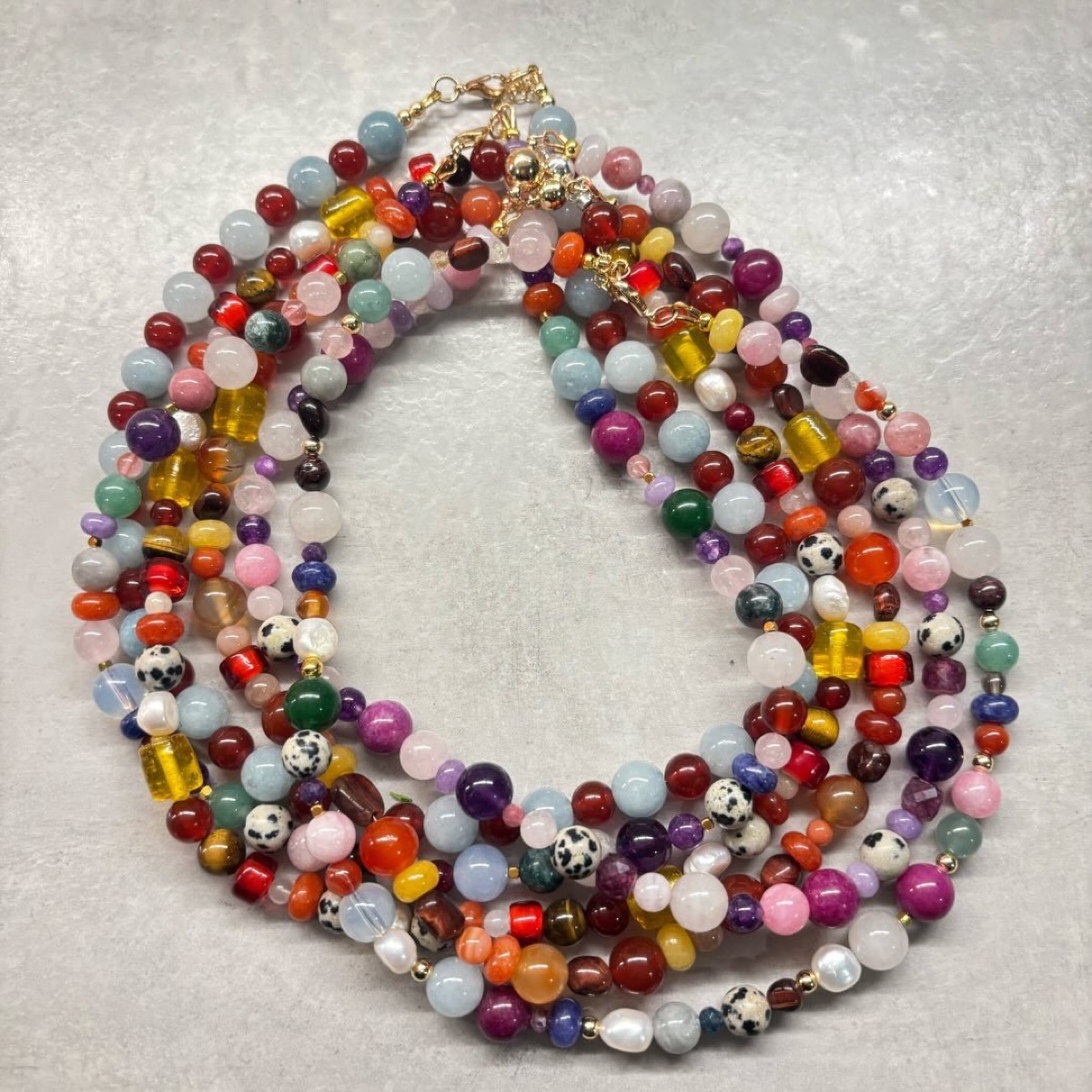 A collection of handmade necklaces by Khaira